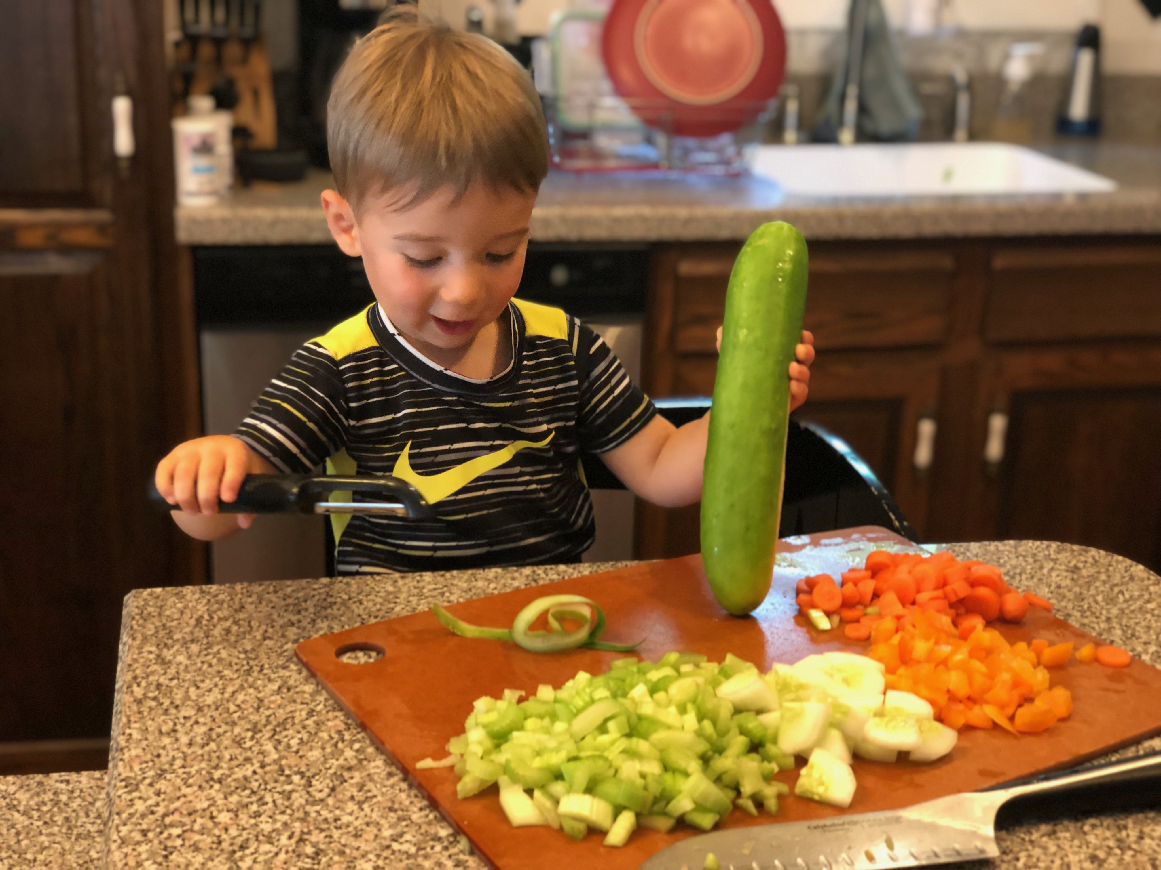 Lincoln cutting vegetables- surprised look